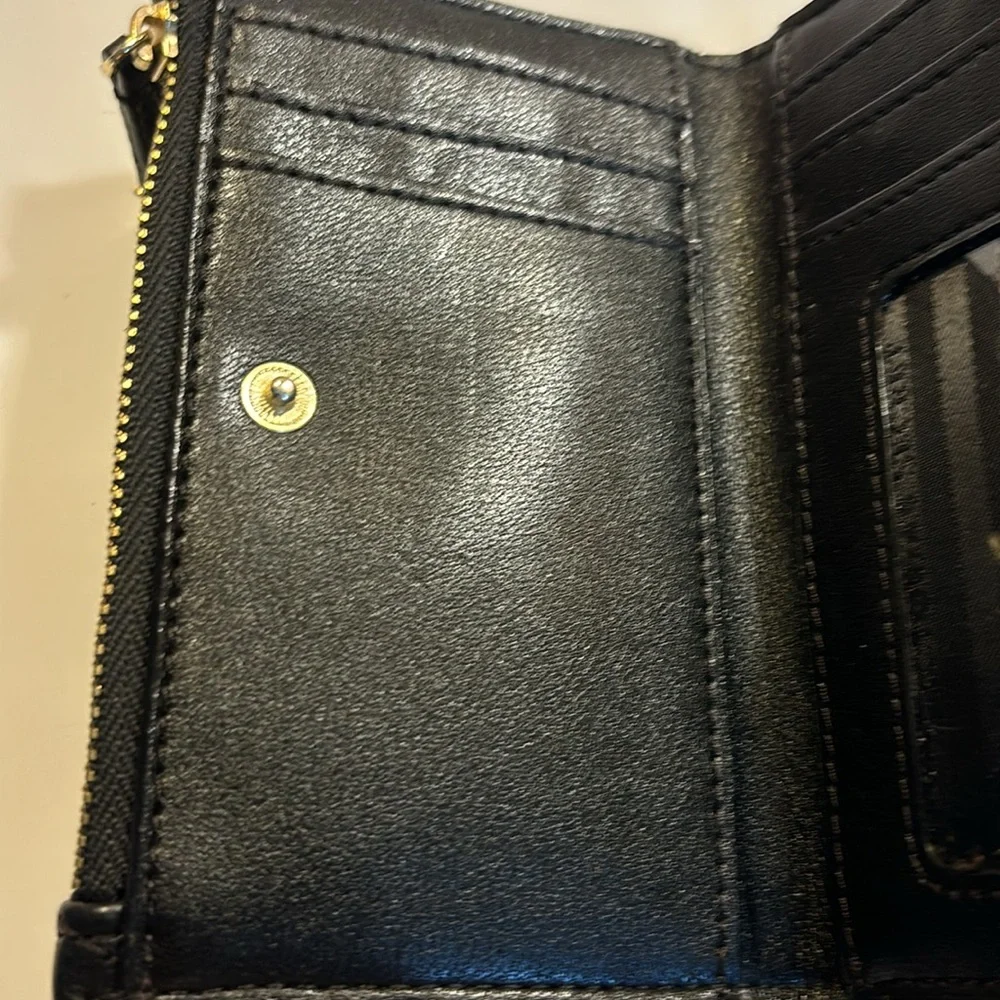Victoria’s Secret small clutch/wallet black with gold color accents.